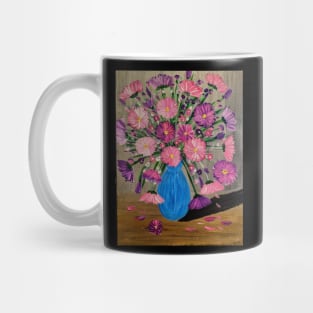 Vibrant pink and purple flowers bloom tall in a striking blue vase, adorned with touches of metallic paint for an extra shimmer Mug